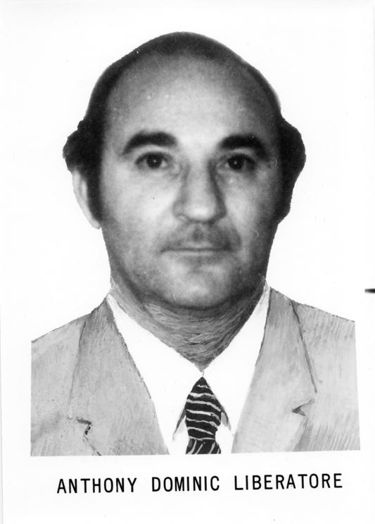 Anthony Dominic Liberatore: head-and-shoulders photograph of a man in a light jacket and striped tie, with his name printed below.
