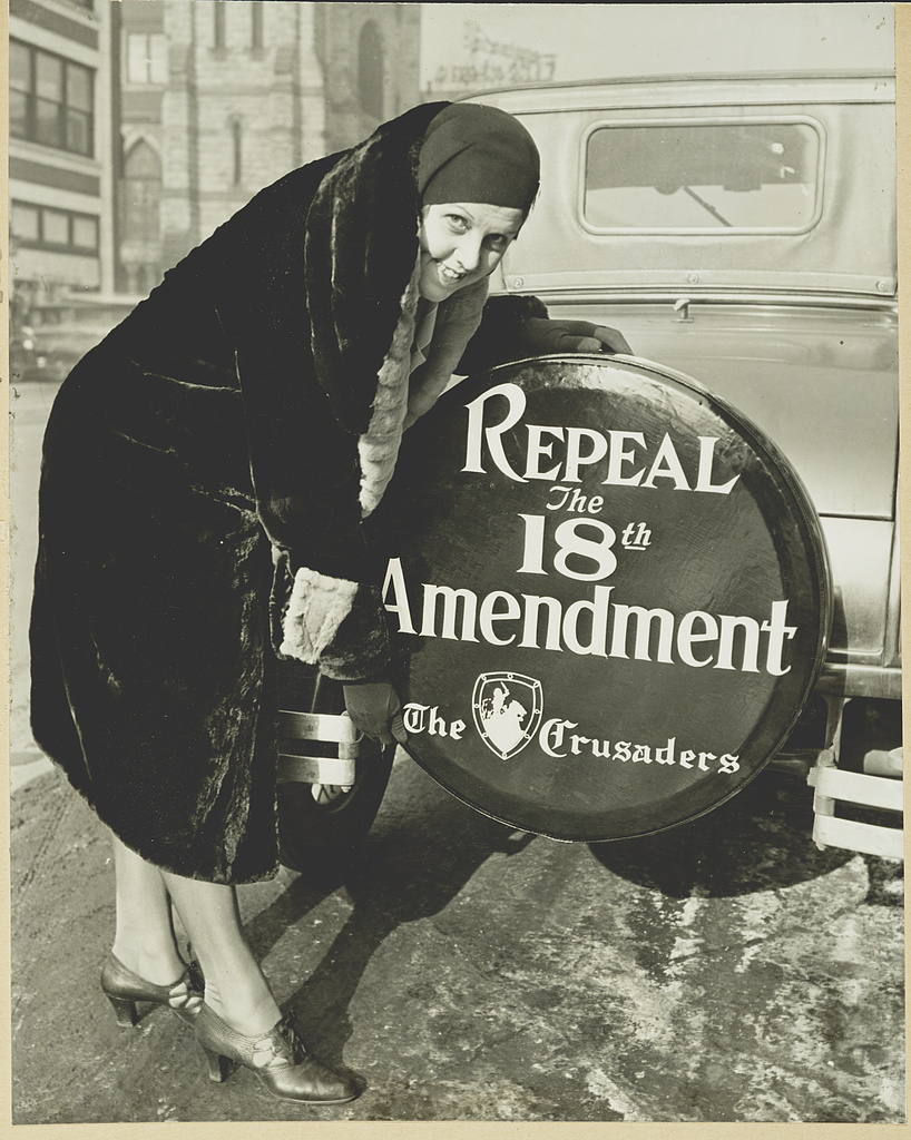 Elizabeth Thompson of Chicago with a tire cover on her car reading Repeal the 18th Amendment.