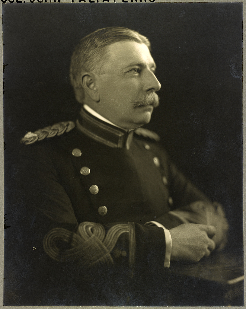 Portrait of a man in a dress uniform with epaulets, seated in profile with his hands folded.