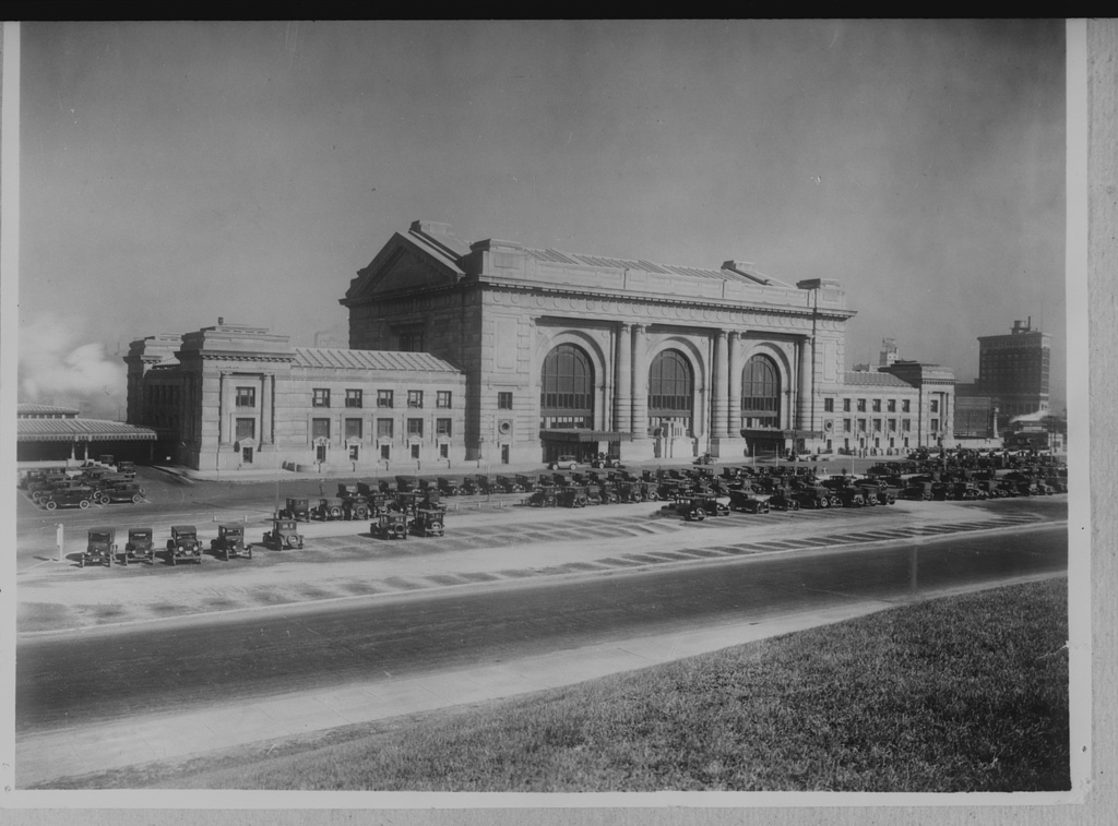A black-and-white photograph of Kansas City Union Station seen from across the street