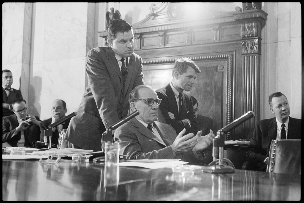 Senators and committee counsel Robert F. Kennedy at a hearing in the Senate Caucus Room, 10 February 1959.
