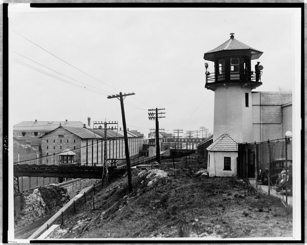 Exterior of Sing Sing prison with a guard tower and the old cell block.