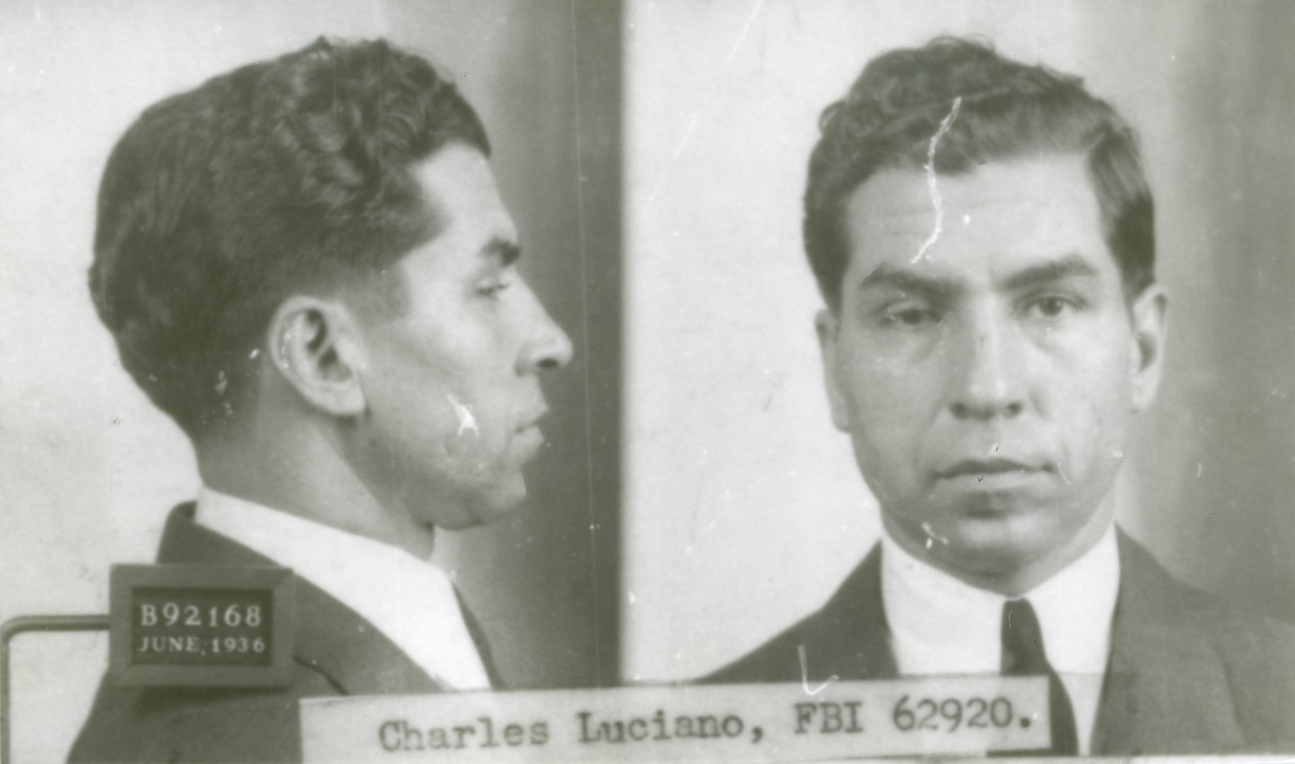 Front and profile police photographs of Charles Luciano with a placard reading B92168 June 1936.