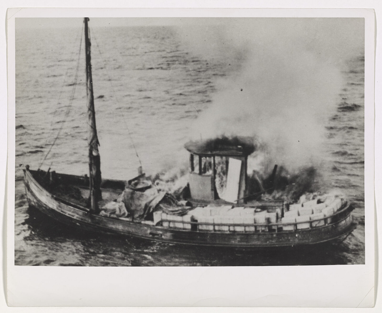 The vessel LINWOOD burning at sea.