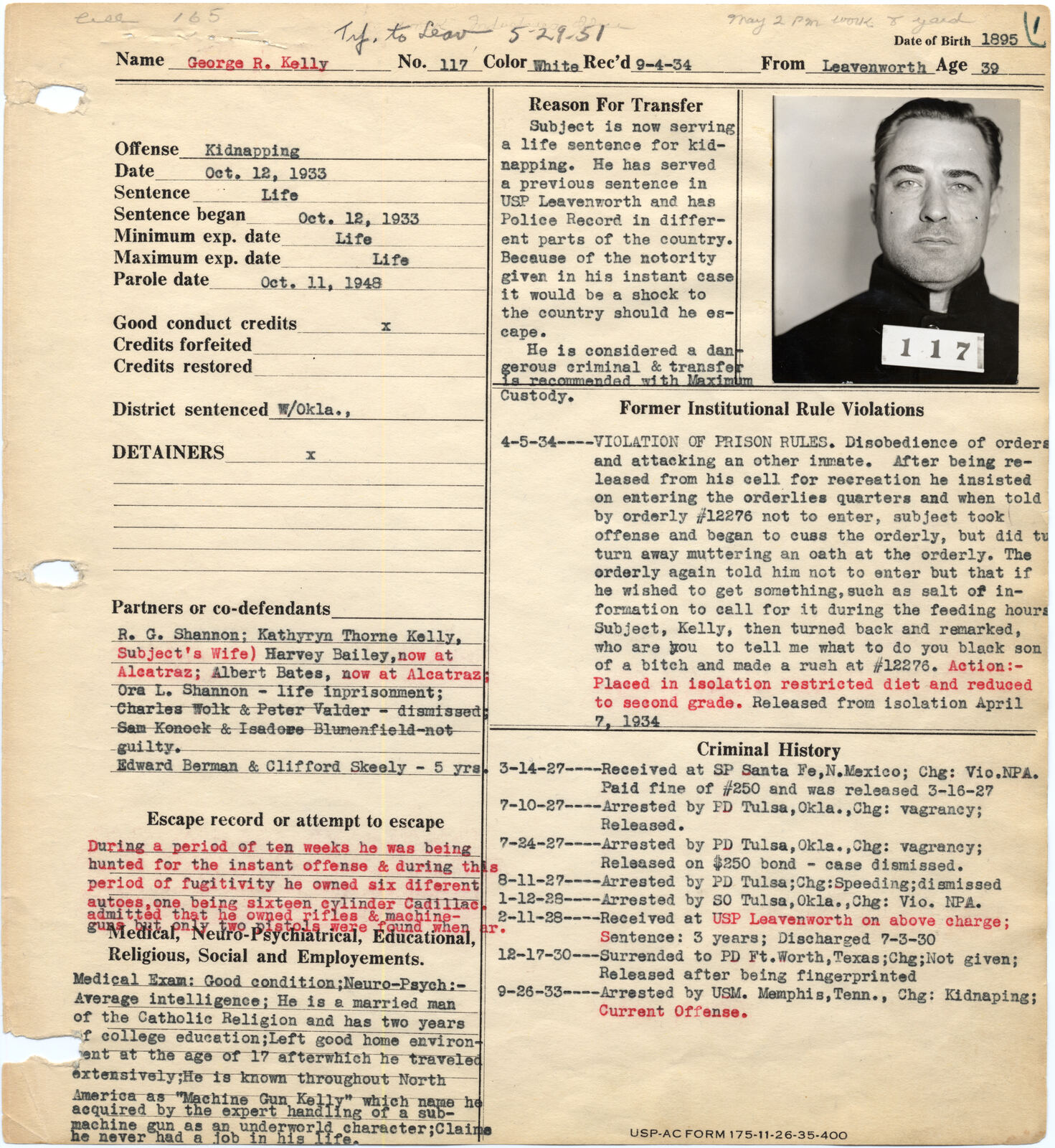 Alcatraz warden's notebook page with the identification photograph of George R. Kelly holding a card numbered 117, above typed commitment details.