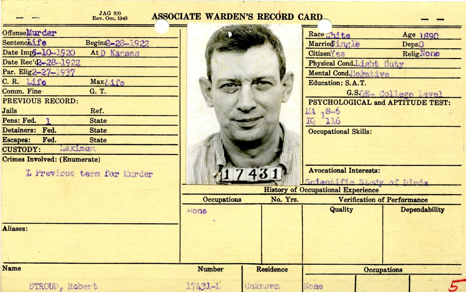 Associate Warden's Record Card for Robert Stroud with an identification photograph and typed and stamped entries on a yellow card.